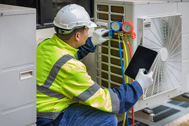 Professional Air Duct Cleaning technician working in Fredericksburg, VA